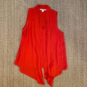 Red draped sleeveless shirt